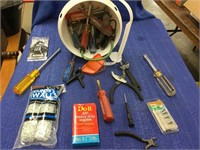 Miscellaneous tools in small bucket