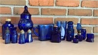 Assorted blue bottles, salt & pepper, jars,
