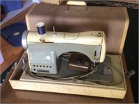 Vintage Necchi sewing machine plus attachments