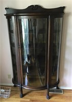 Early curved glass display cabinet