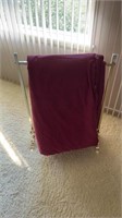 Clothing rack with twin comforter