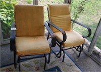 Pair of patio glider chairs with cushions