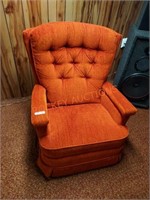 Orange rocking recliner chair