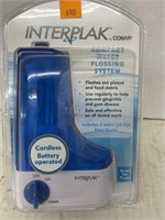 Interplak compact water flossing system. Conair.