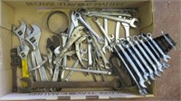 Assortment of crescent wrenches, wrenches, vise