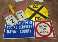 (5) Assorted signs including slow no wake,
