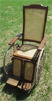 Gendron Co. antique oak and cane wheel chair.