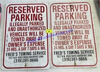 Pair of Fred's Towing Reserved Parking Signs