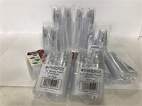Sealed packs of round plastic shot glasses