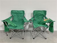 Pair of green folding camping chairs with cases