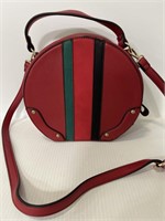 Red leather circular handbag with stripes