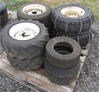 pallet of rear lawn mower tires and rims