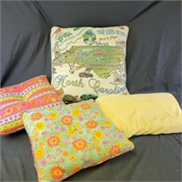 Group of Toss Pillows, one is North Carolina