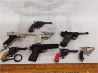8 miniature cap guns