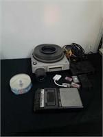 Pocket tape recorder, slide projector, cassette