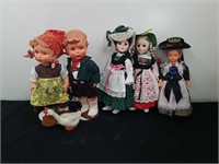 A group of collectible dolls