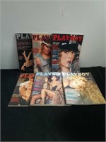 Group of bags and protected Playboy magazines