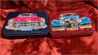 2 metal candy tins with cars on them