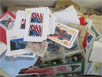 Box of world stamps on paper Good cond