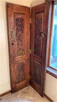 Pair of antique carved wood doors w/brass door