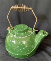 Vintage enamel and cast-iron kettle.