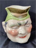 Antique face pitcher stands 8 inches tall by 8