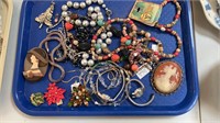 Tray lot of costume jewelry - watches, pins, one