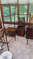 Antique wooden clothes rack with swivel sides.
