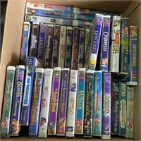 Box of VHS Movies Including Shrek, Aladdin,