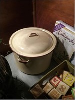 Yellow and brown enamelware lidded pot