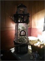 Decorative bird cage shaped like a lighthouse