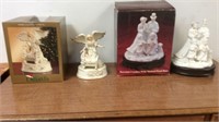 Two musical Christmas figurines with box