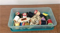 Container of tread and other sewing items
