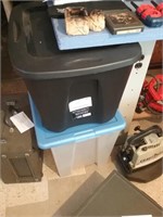 Group of two rubber totes with lids one clear o