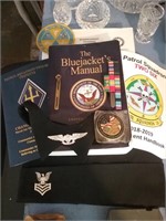 Group of military books ribbons and badges