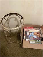 Box of country living magazines and metal plant