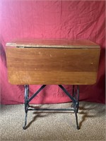 Cherry drop leaf table on sewing machine base