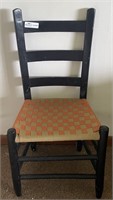 Black painted ladder back chair.