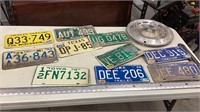 Vintage license plates and wheel cover