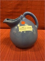 Blue  glazed pottery milk pitcher.