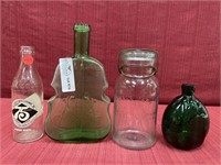 Three bottles and a lightning aqua glass canning
