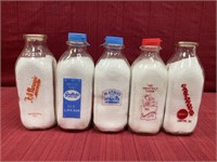 Five glass milk bottles Mueller’s dairy