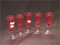 Five 5" high cranberry and clear liqueur goblets