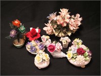 Nine china flower figurines including