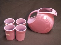 Fiesta disc pitcher and four tumblers in lilac,