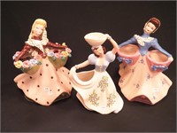 Three ceramic figurines of women: Heidi Schoop,