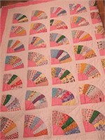 Handstitched quilt in a fan pattern, cream