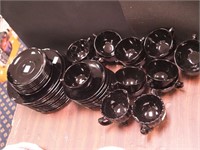 49 pieces of black glassware including plates,