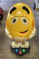 Yellow M&Ms store display on casters