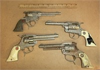 4 cowboy cap guns Hubley, Roy Rogers, etc.